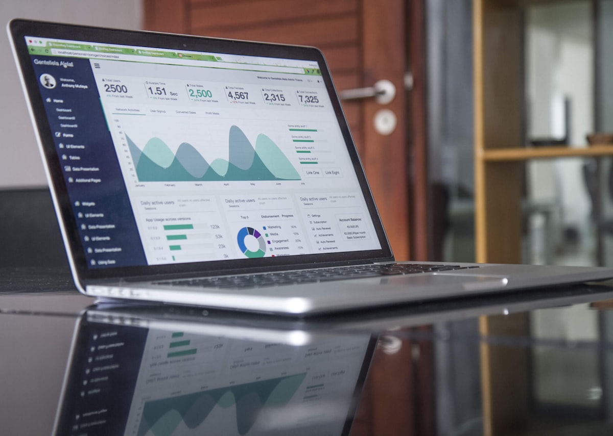 Laptop displaying clean financial dashboards and reports